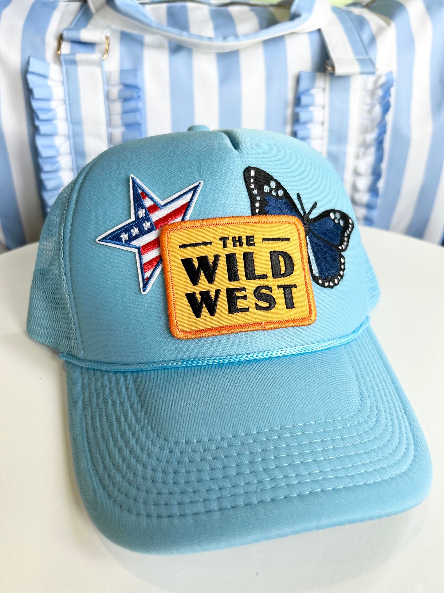 wilder than the west trucker hat