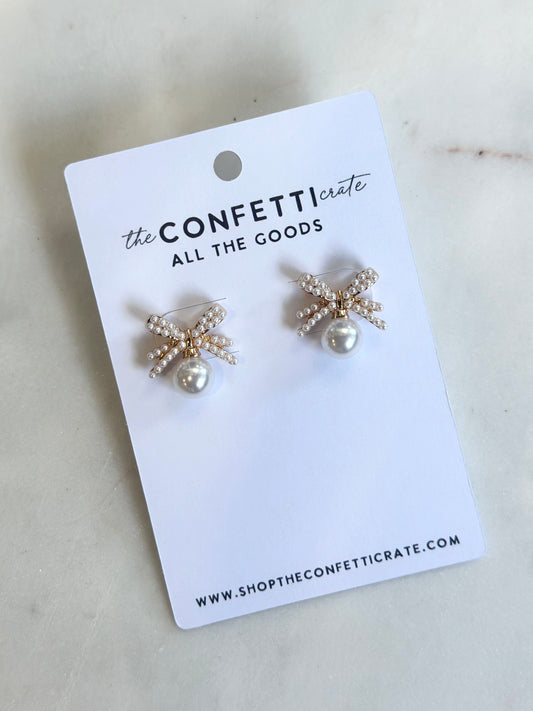 drop pearl on bow stud earrings