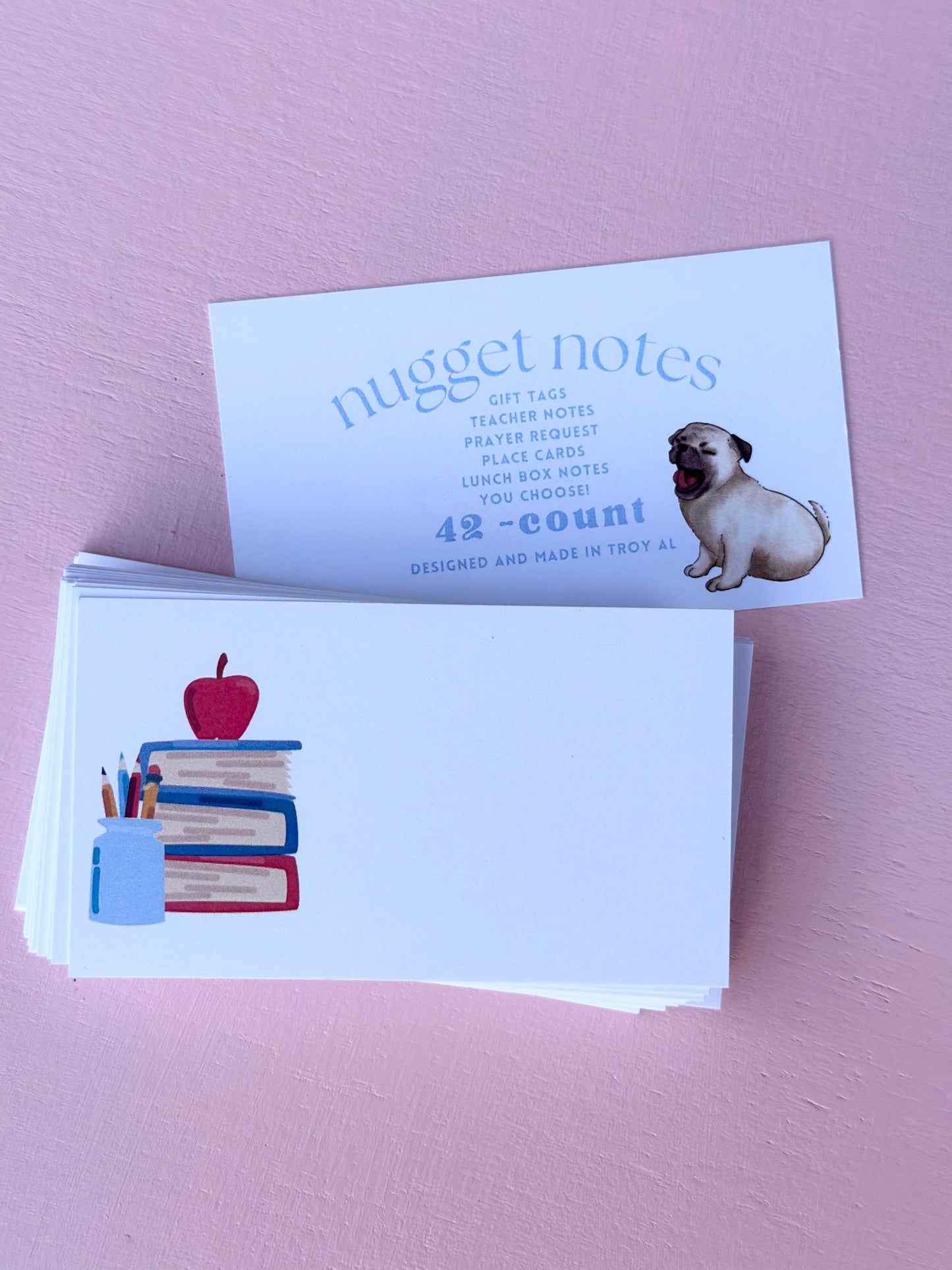 nugget notes - book stack pencils and apple