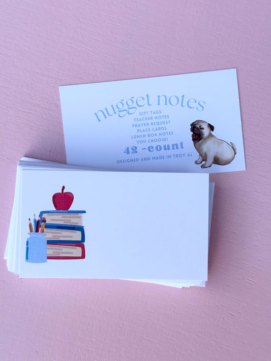 nugget notes - book stack pencils and apple